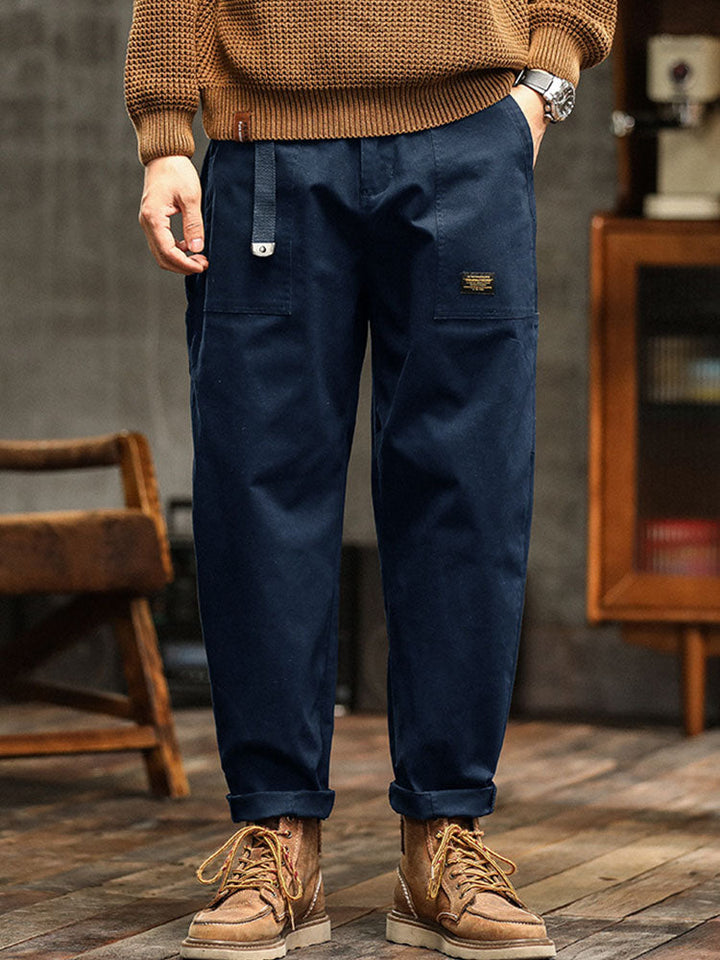Navy blue men's utility pants with adjustable cuffs, vintage style for everyday comfort.