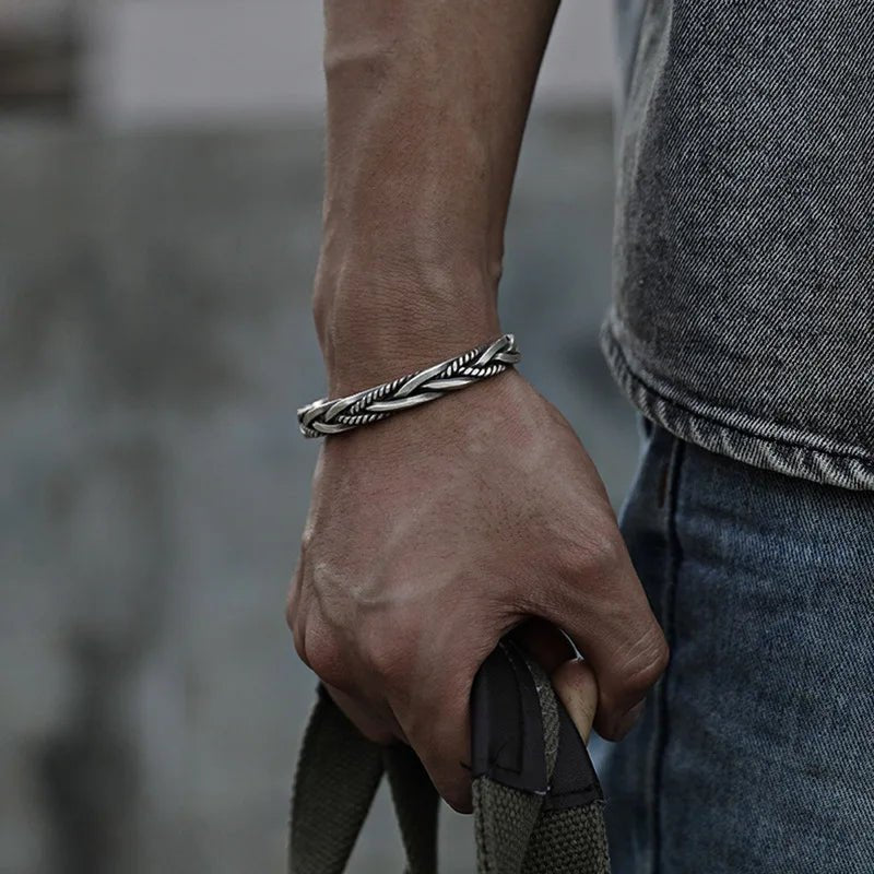 Men's braided sterling silver cuff bracelet. Handcrafted, oxidized finish, and adjustable for a perfect fit.