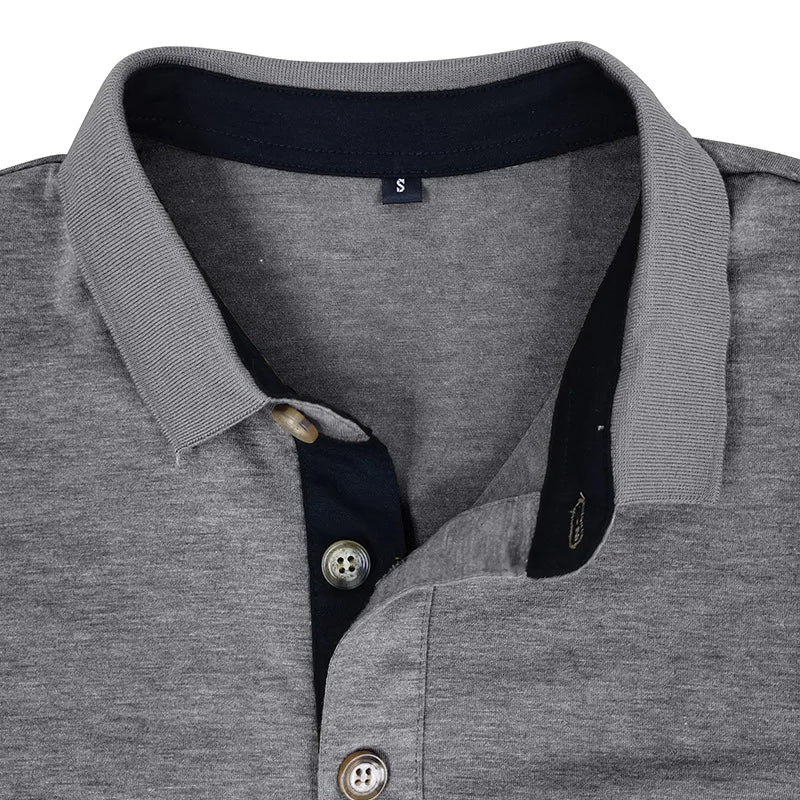 Close-up of the collar on a men's breathable long sleeve polo, showcasing quality & style.