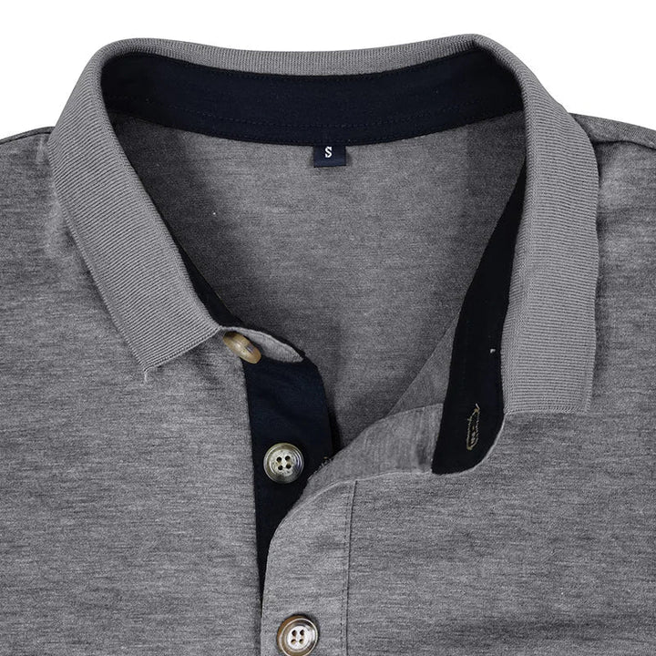 Close-up of the collar on a men's breathable long sleeve polo, showcasing quality & style.