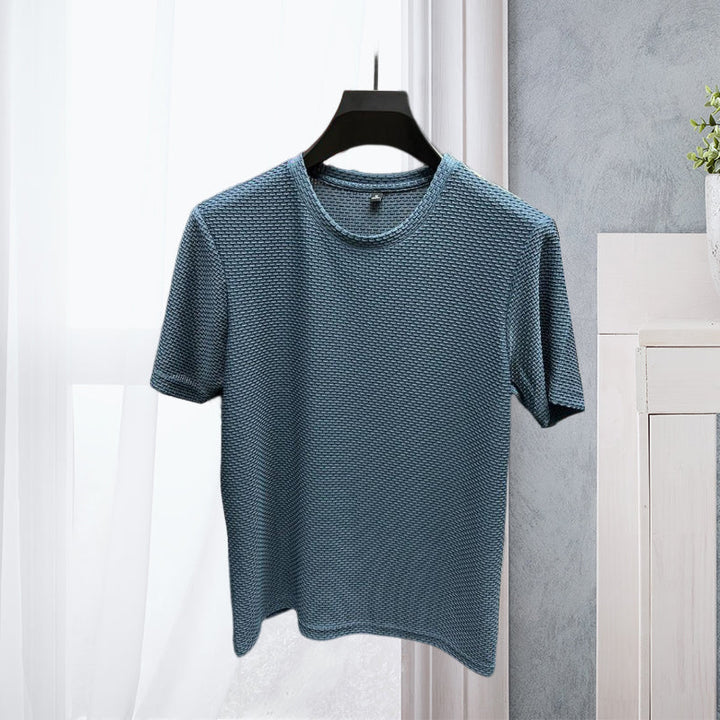 Detail of the neckline and stitching on a men's breathable mesh ice silk t-shirt, quality summer apparel.