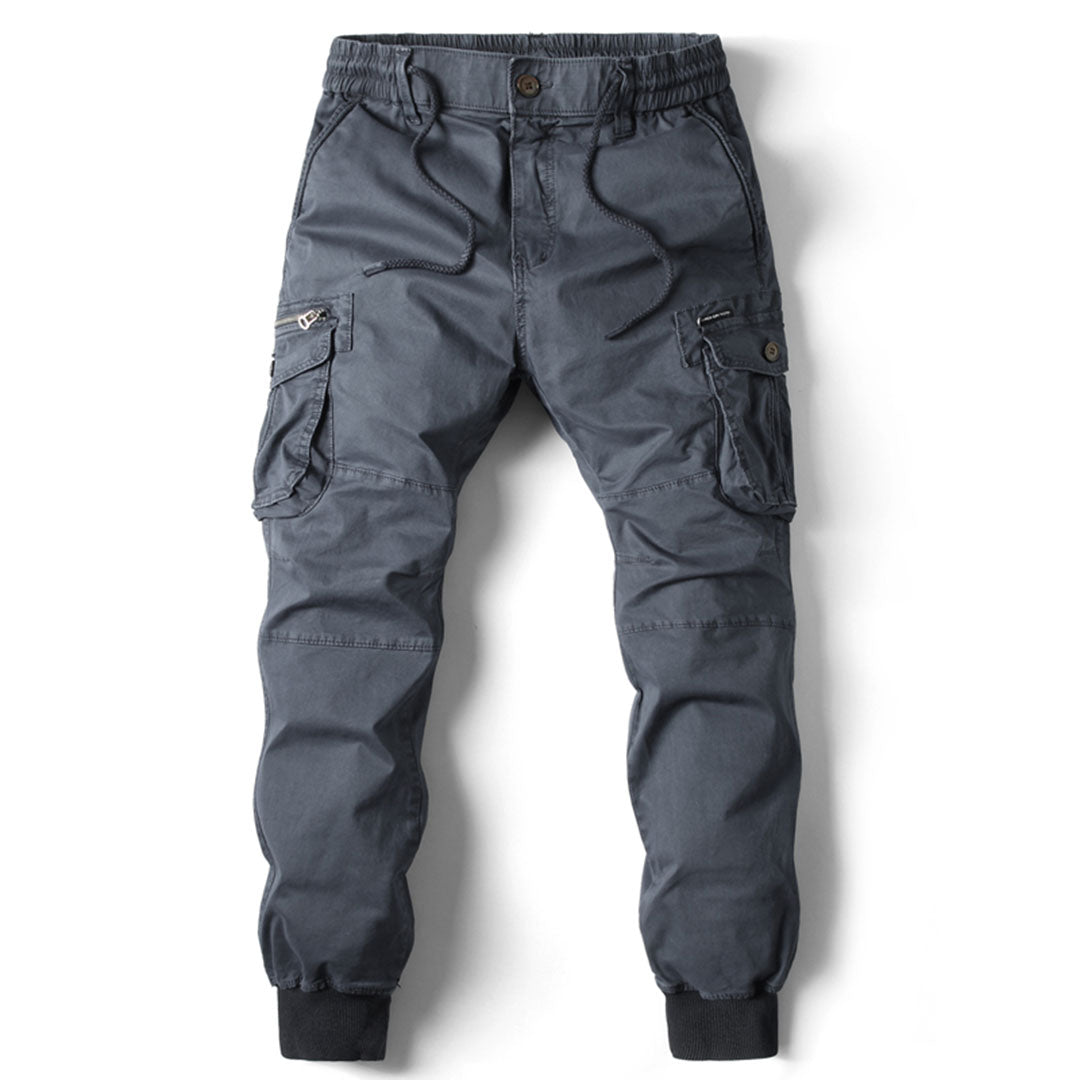 Men's black casual pants with an elastic waist and tapered leg, suitable for various occasions.
