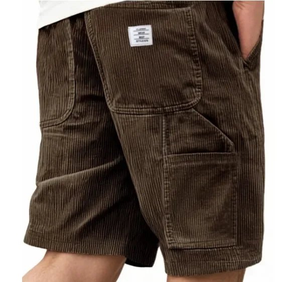 Men's knee-length cargo shorts, relaxed fit. Features multiple utility pockets for essential storage.