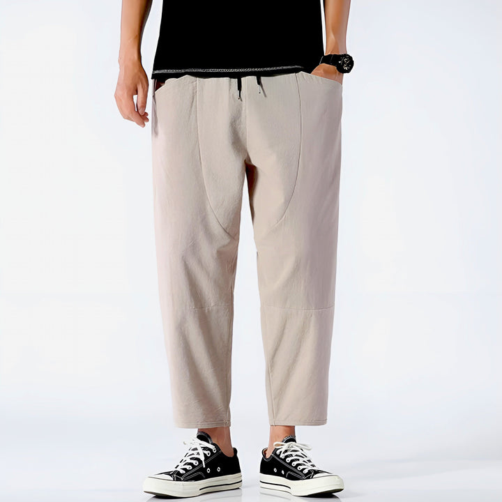 Modern men's cropped drawstring trousers, great for lounge or casual outdoor activities.