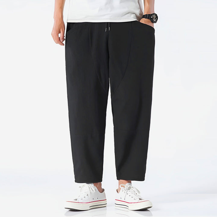 Trendy men's fashion: Cropped drawstring chino trousers for a relaxed yet stylish outfit.