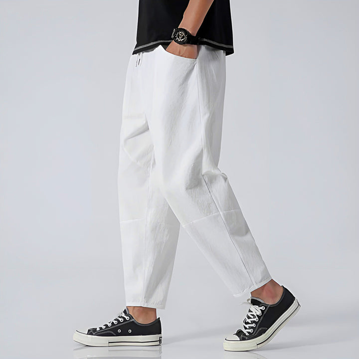 Close-up of the drawstring detail on men's comfortable cropped chino pants.