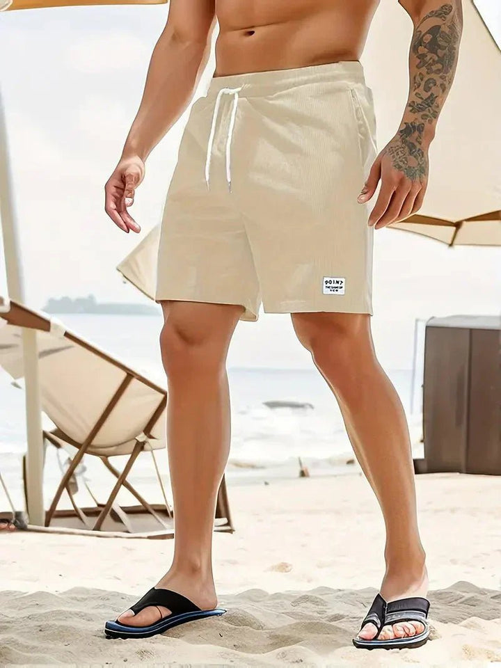 Essential men's summer shorts: elastic waist, drawstring, and a comfortable, relaxed fit.