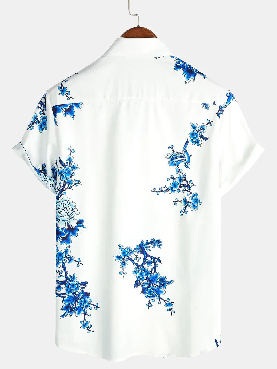 Stylish men's vibrant floral print short-sleeve summer shirt, perfect for casual outings & beach fashion.