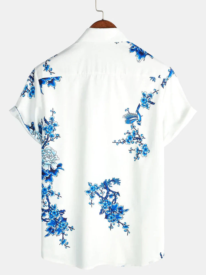 Stylish men's vibrant floral print short-sleeve summer shirt, perfect for casual outings & beach fashion.