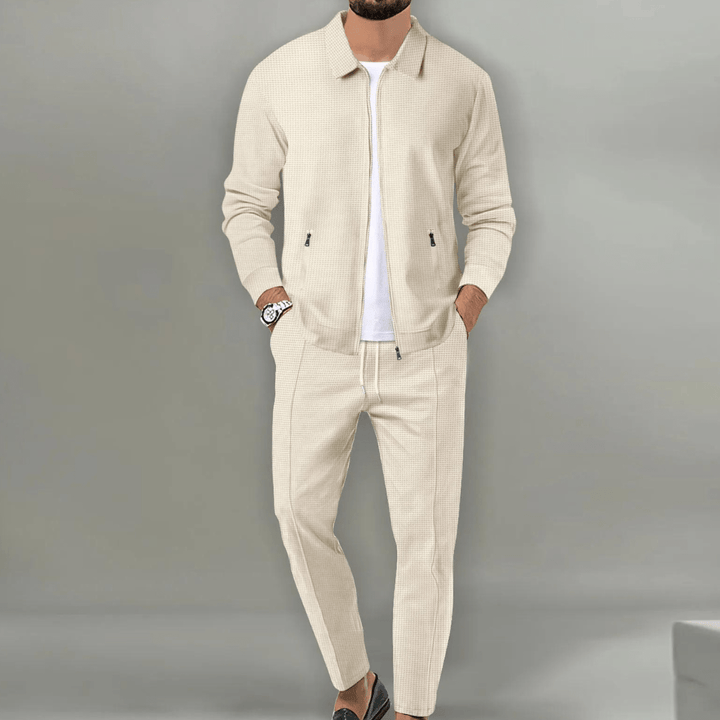 Men's casual grey tracksuit with zip-up jacket and matching jogger pants, comfortable loungewear.