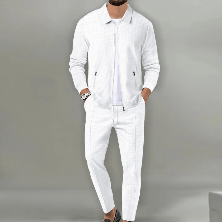 Two-piece men's sportswear tracksuit with a full-zip jacket and relaxed fit joggers.