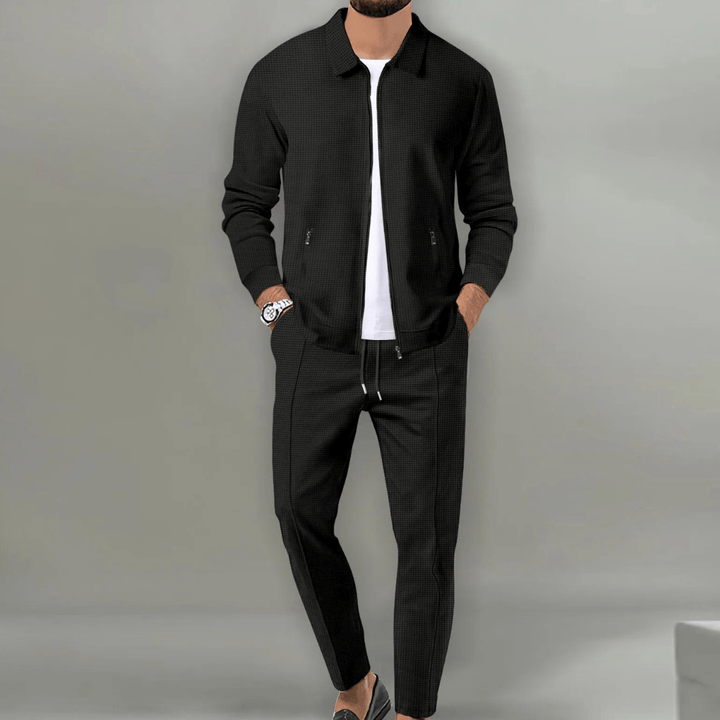 Stylish men's casual tracksuit, perfect for leisure or light activities, featuring a zip jacket.
