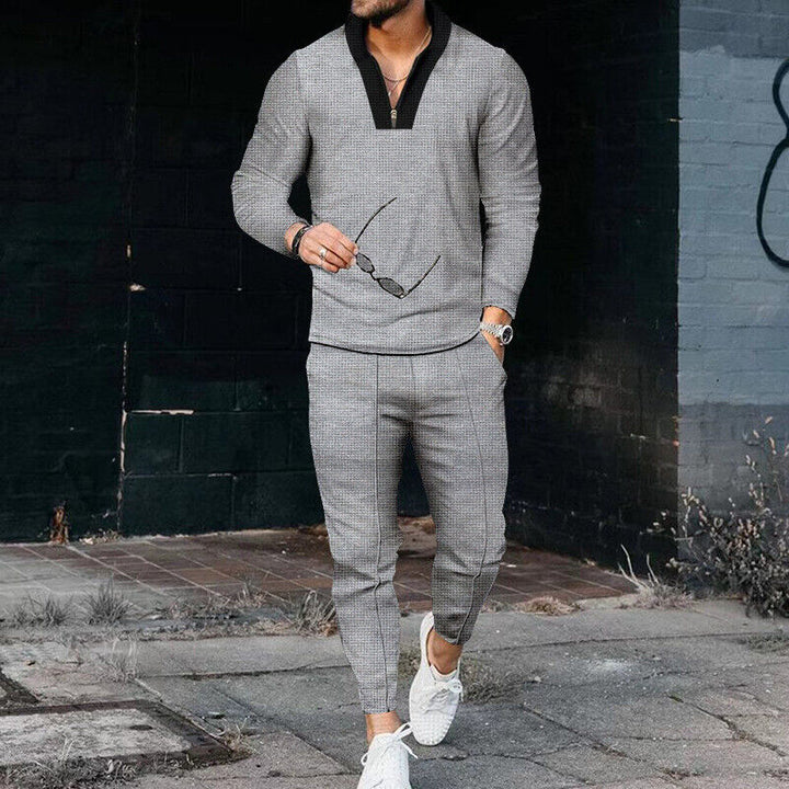 Front view of a men's casual khaki two-piece set: a zip top paired with comfortable, modern-style trousers.