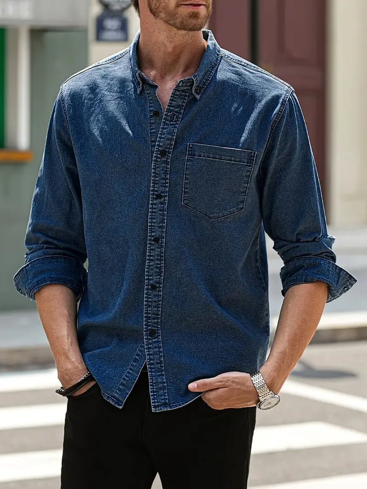 Stylish men's fall denim shirt. Long-sleeve button-up, perfect for casual autumn fashion.