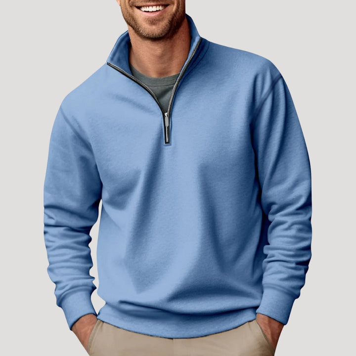 Folded men's quarter zip sweatshirt in a deep burgendy, ready for stylish casual wear.