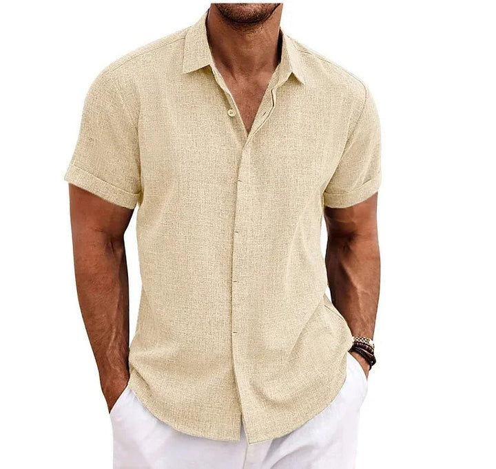 Relaxed fit men's short sleeve button-up shirt. Versatile solid color apparel for casual wear and summer fashion.