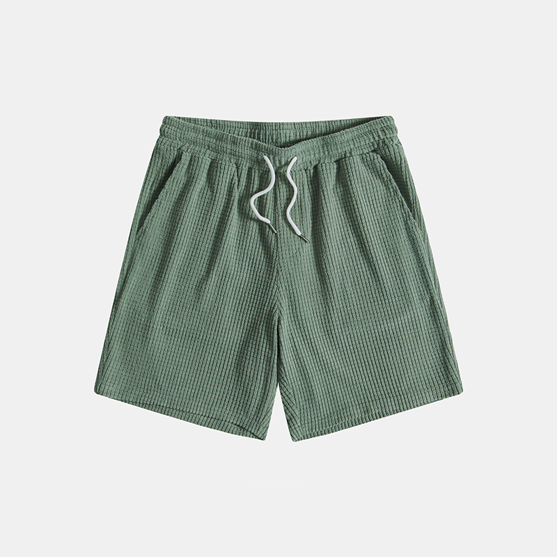 Men's short sleeve shirt and drawstring shorts two-piece set. Casual summer outfit for men's warm weather fashion.