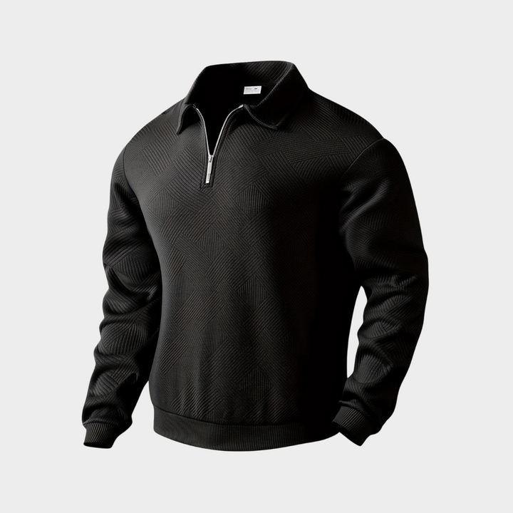 Detail of the half-zip closure on a men's textured pullover, highlighting the zipper quality