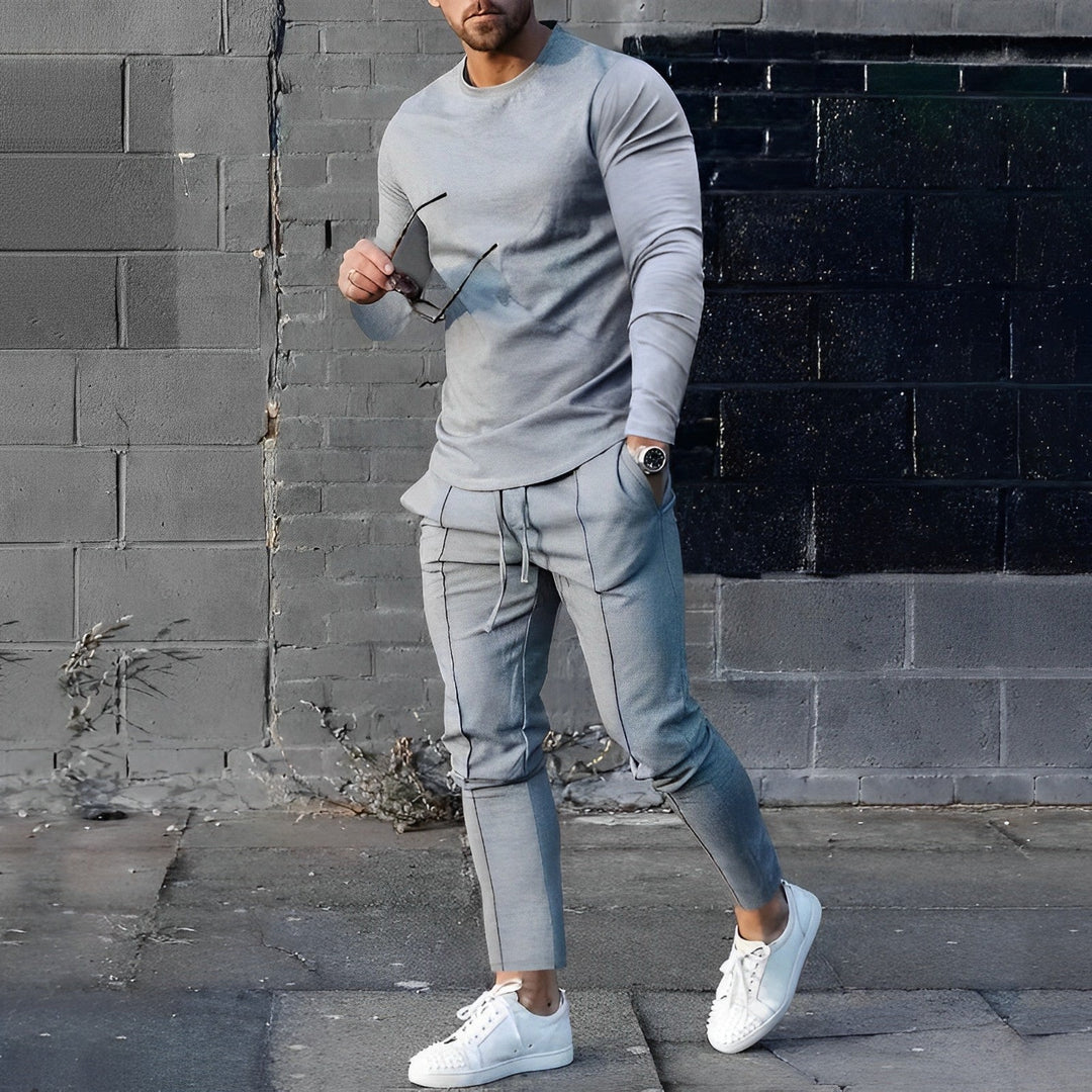 Fashionable men's streetwear outfit: long-sleeve top and joggers for a relaxed look.