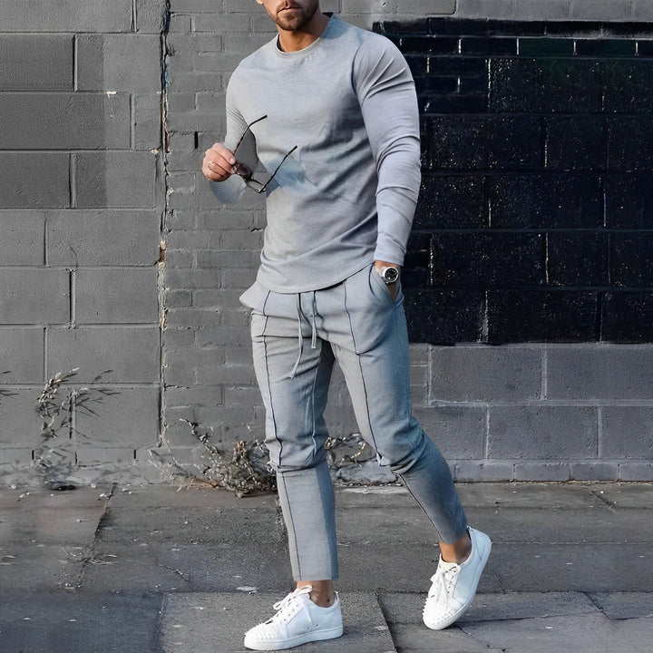 Fashionable men's streetwear outfit: long-sleeve top and joggers for a relaxed look.