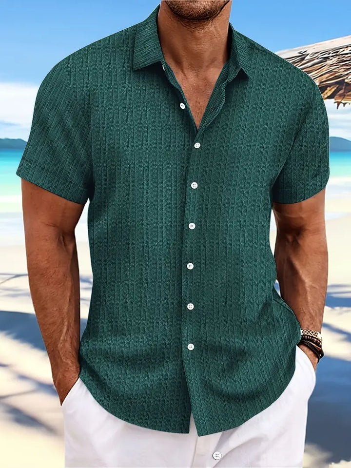 Stylish men's green short-sleeve button-down shirt, great for casual summer outings and comfort.