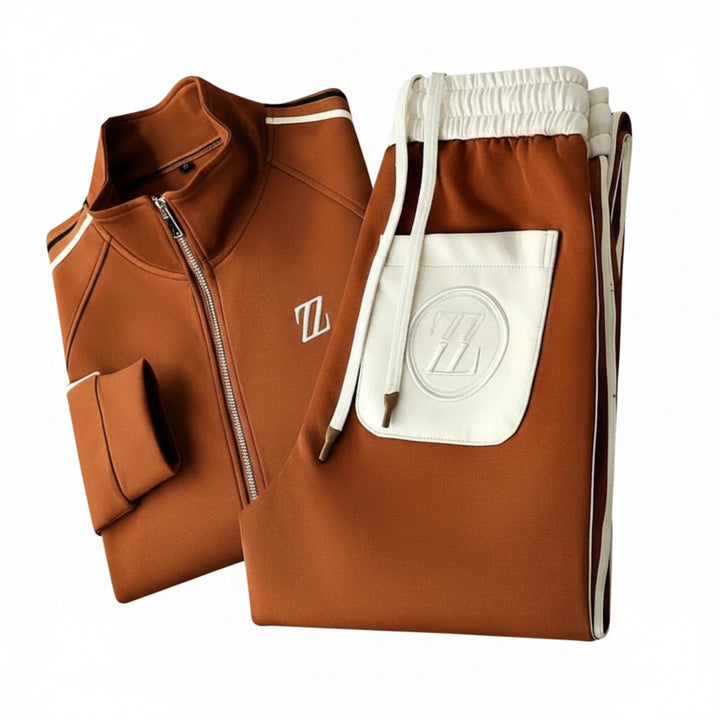 Two-piece men's athletic tracksuit featuring a zip-up jacket and matching joggers with stylish side stripes.