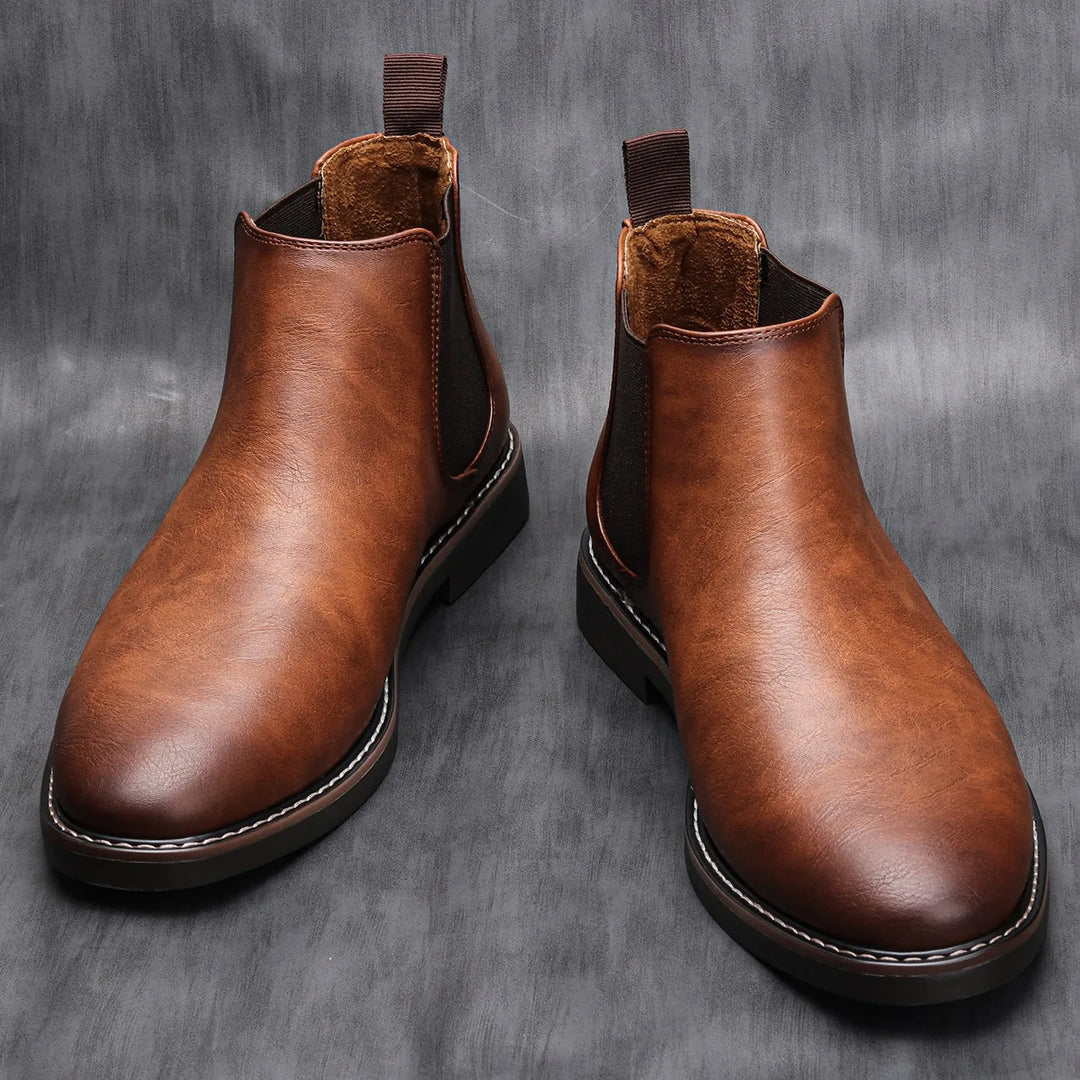 Versatile men's classic black Chelsea boots for formal or casual fall fashion. Durable & slip-on.