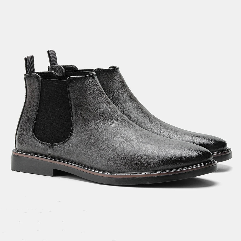 Elegant men's classic black Chelsea dress boots, perfect for formal occasions & stylish fall ensembles.