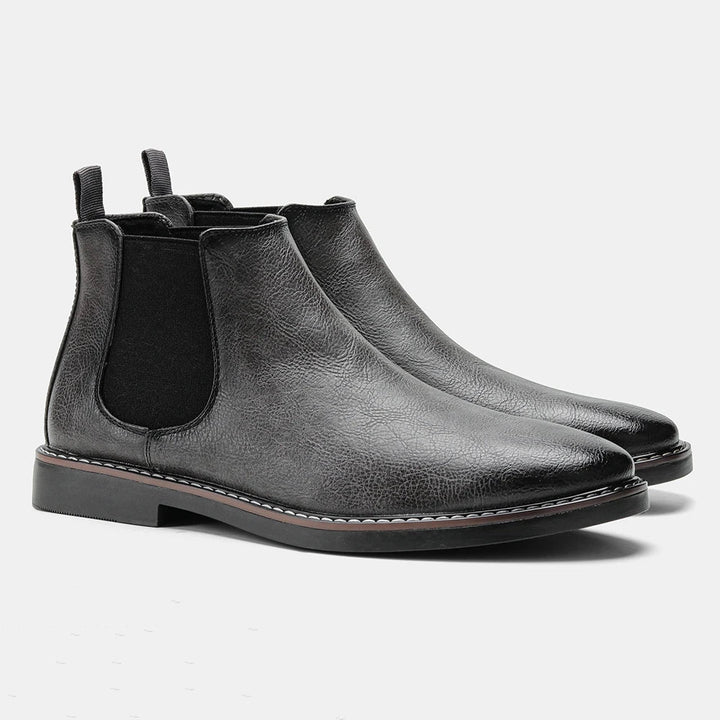 Elegant men's classic black Chelsea dress boots, perfect for formal occasions & stylish fall ensembles.