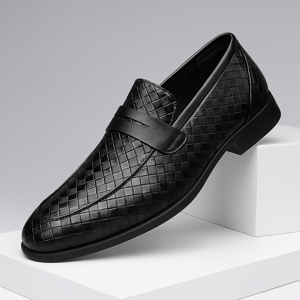 Close-up of dark brown woven leather texture on men's penny loafers, formal dress shoe