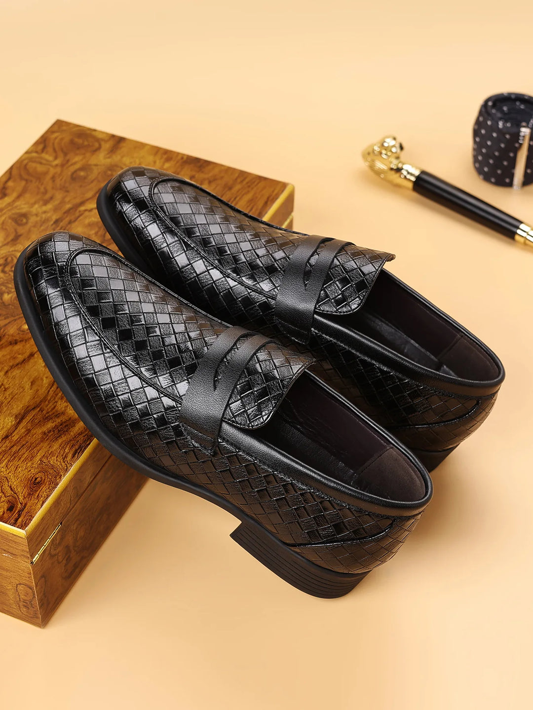 Men's dark brown woven leather penny loafers, a classic formal shoe with comfortable design