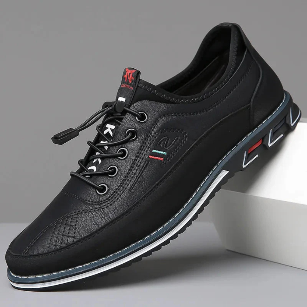 Close-up of men's elegant Oxford dress shoes with intricate stitching & sturdy laces, offering classic formal style.