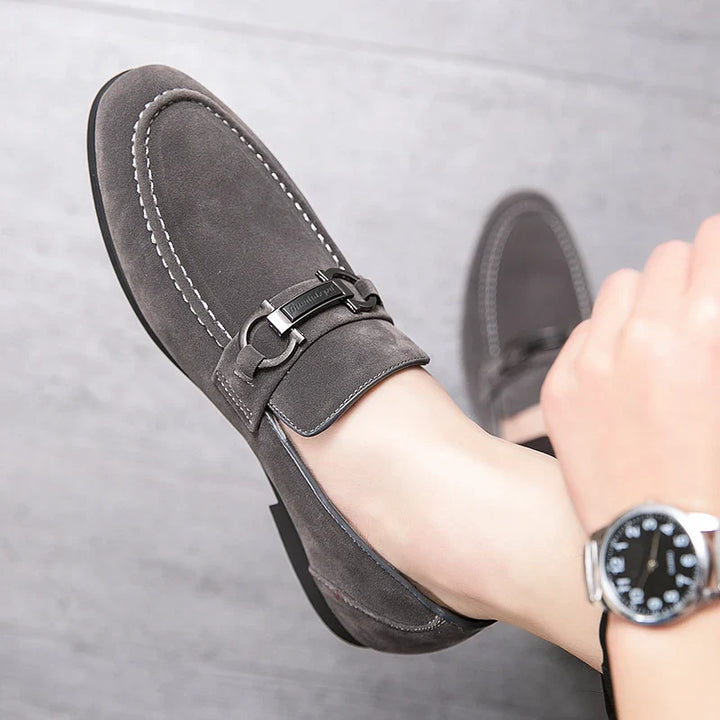 Close-up of a men's black suede bit loafer, showcasing the luxurious texture.