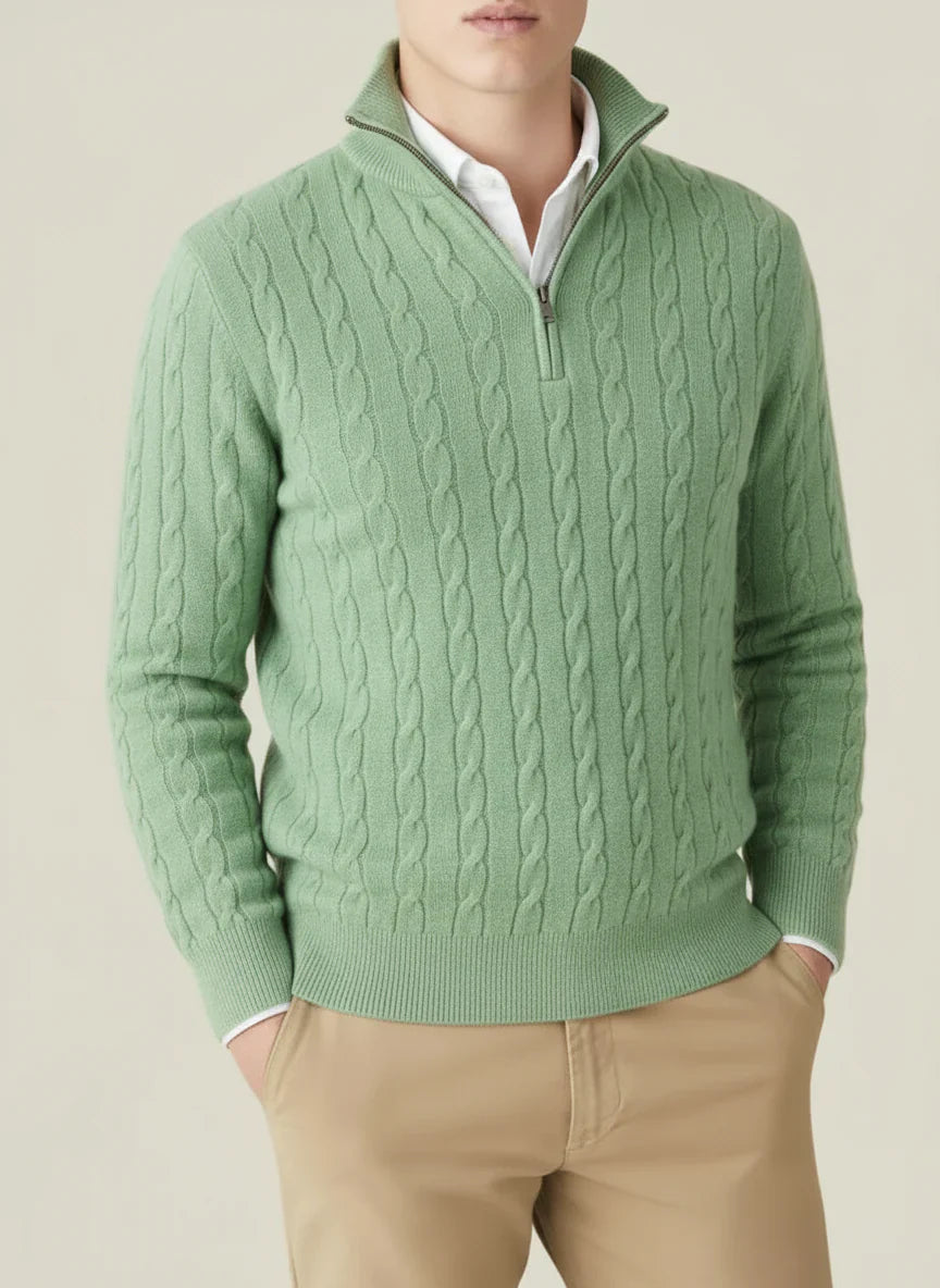 Detailed image of the zipper and collar of a men's cable knit half zip pullover sweater, highlighting design.
