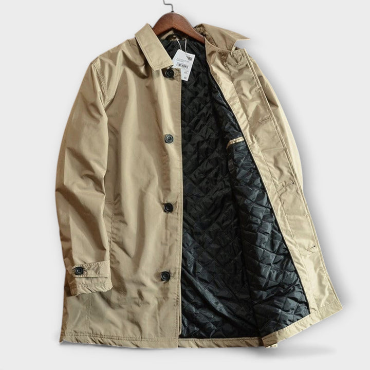 Close-up of men's classic car coat showing point collar & premium fabric detail for fall fashion.