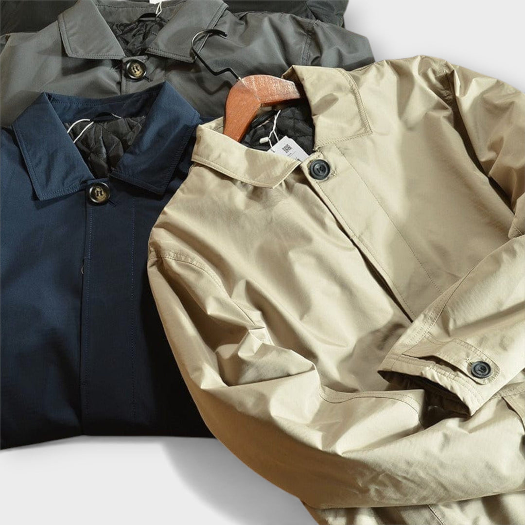 Men's classic car coat on display, highlighting button front, point collar & elegant design.