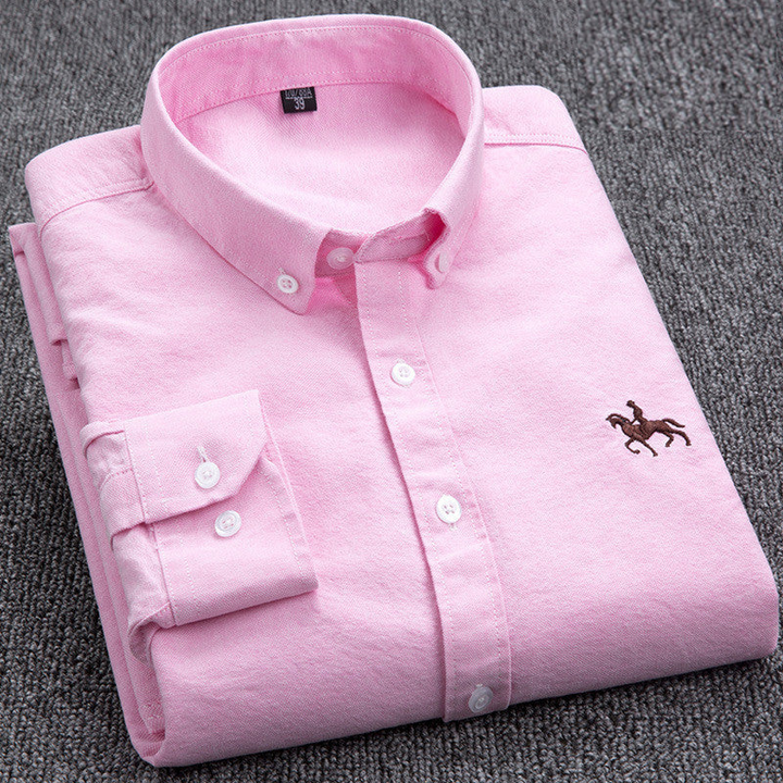 Detailed view of the collar and buttons on a men's stylish checkered casual shirt.