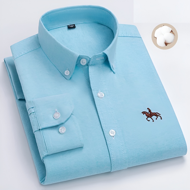 Folded men's checkered button-down casual shirt, showcasing its classic pattern. Long sleeve.