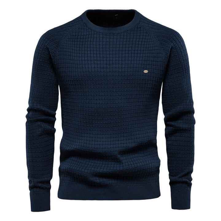 Stylish man wearing a warm, casual men's knit sweater, ideal for everyday wear