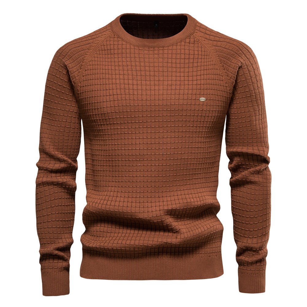 Detailed shot of the cuffs and hem of a men's warm knit casual sweater, emphasizing quality