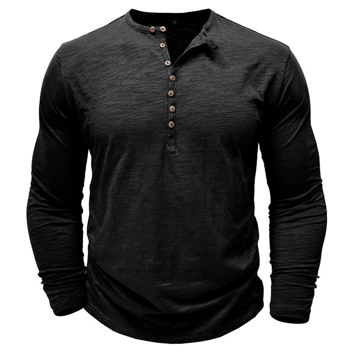 Close-up of the cuff detail on a men's classic henley shirt.