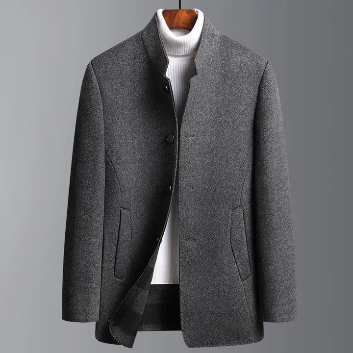 A man wearing a sophisticated classic mid-length wool-cashmere coat. Perfect for business or casual fall fashion.