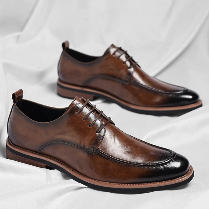 Elegant men's dress footwear, classic oxford style with a rich burnished finish, ideal for weddings.