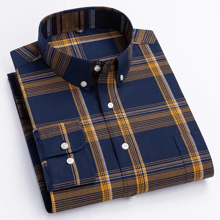 Close-up of a men's long sleeve plaid shirt, showcasing the fabric texture and button detail
