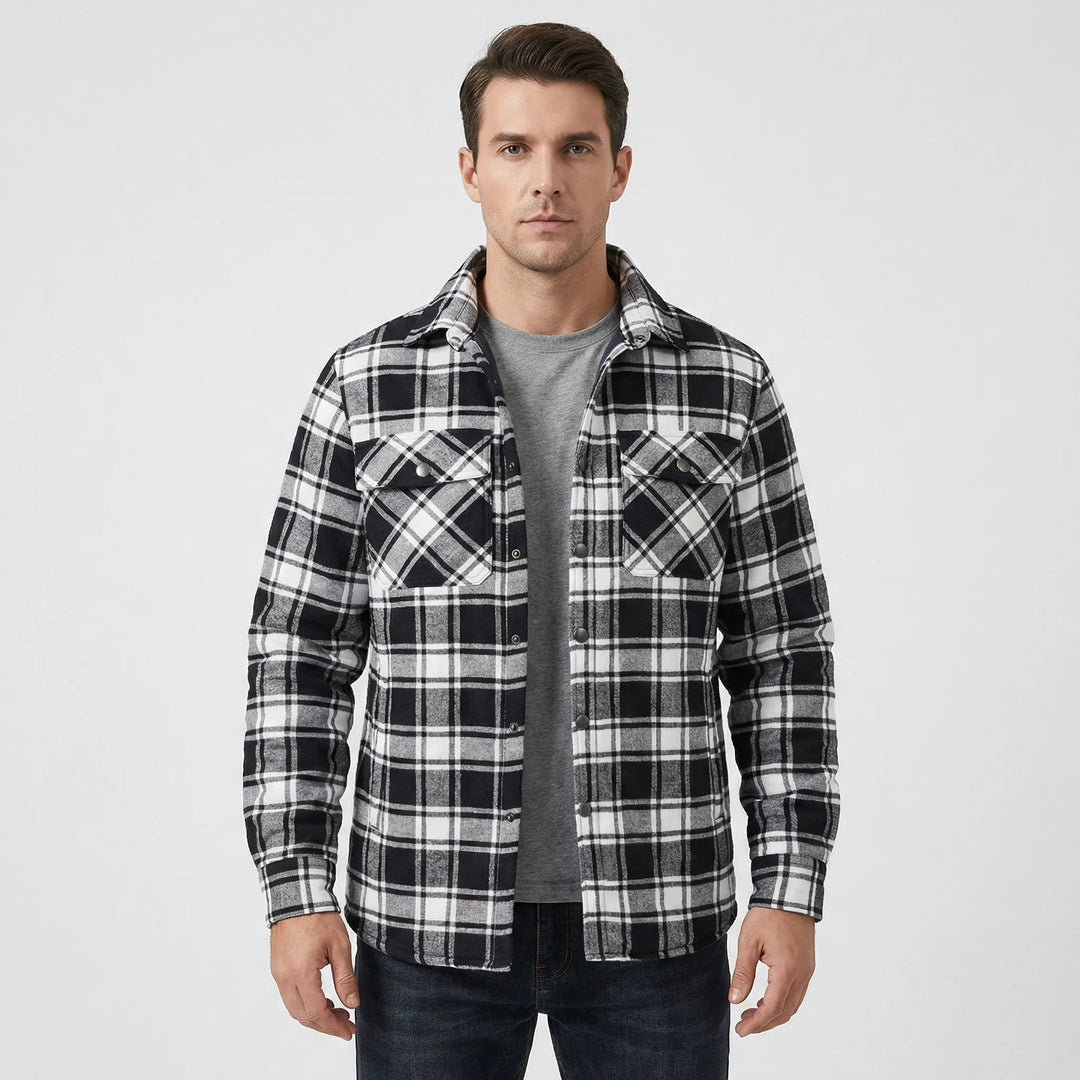 Heavy-duty men's plaid lumberjack jacket with soft quilted lining, ensuring warmth in winter.