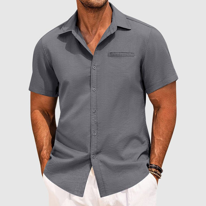 Modern men's summer fashion: classic short-sleeve button-down shirt with a practical chest pocket for style.