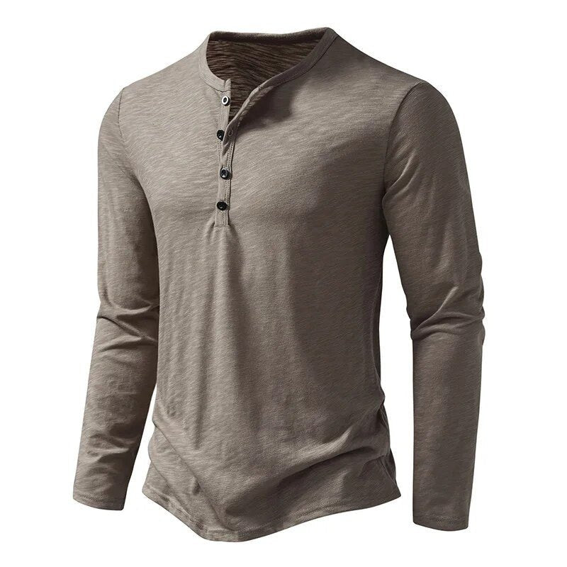 Stylish men's long sleeve henley top with button placket. Slim fit design for comfort.