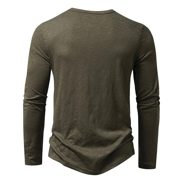 Men's long sleeve henley with button placket. Slim fit, ideal for casual everyday wear.