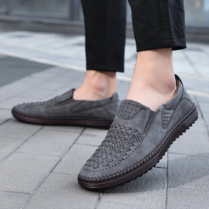 Men's classic slip-on loafers on a white background, highlighting product details and style.