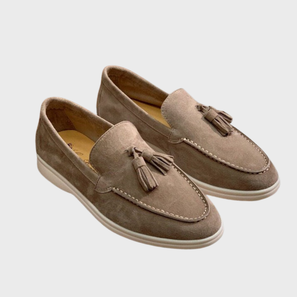 Pair of Men's Suede Tassel Loafers on a white background, emphasizing their clean and sophisticated formal look.